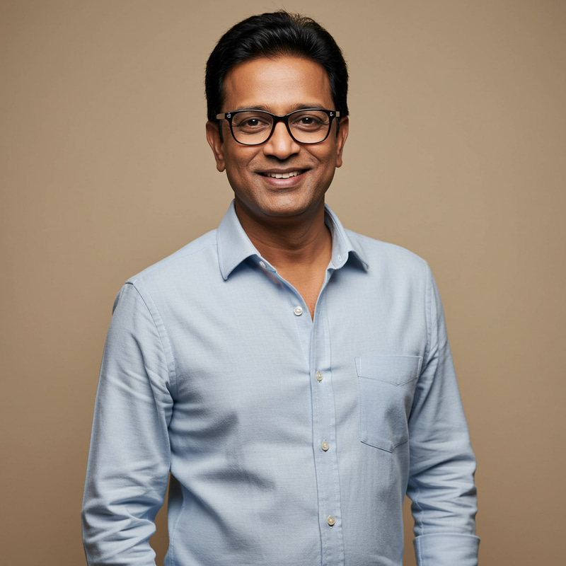 Confident Indian Guy with Glasses and Sharp Features