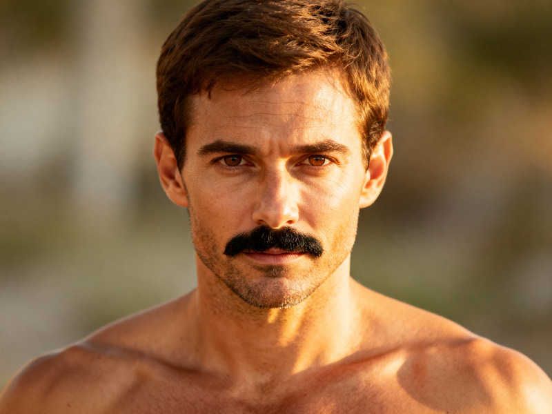 Stylish Man in 30s: Brown Hair and Beard Look