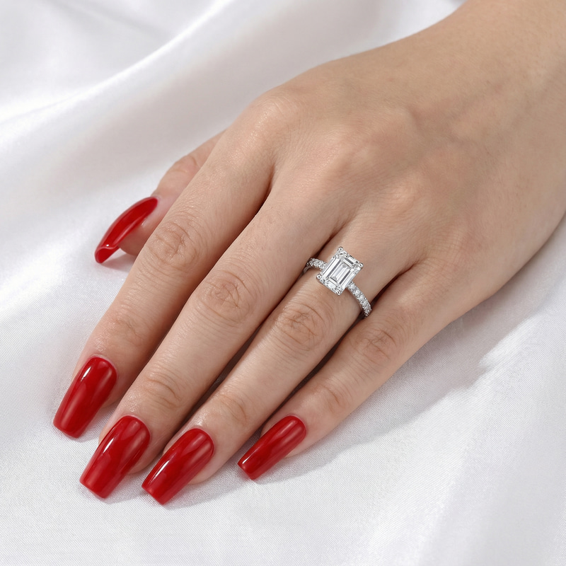 Elegant Small Engagement Ring on Red Nails Close Up